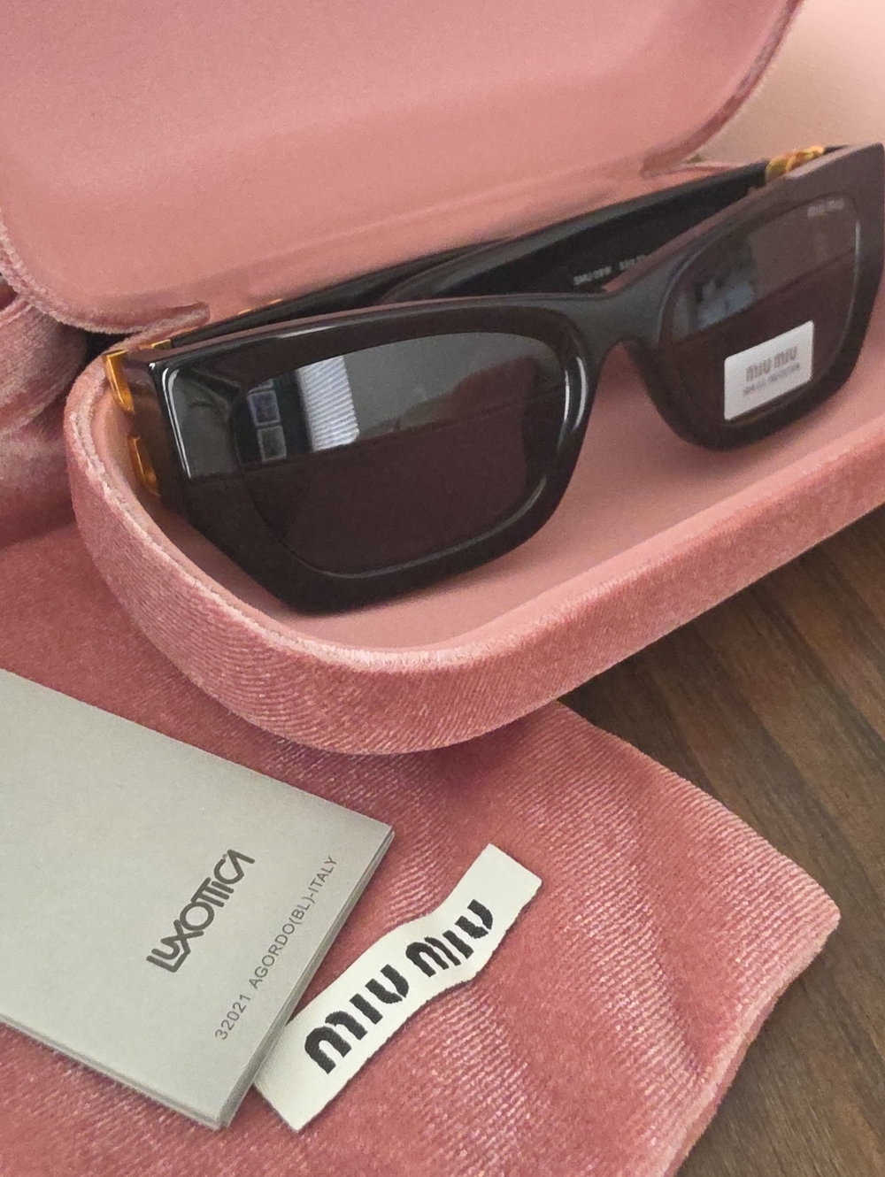 Miu Miu Glossy Black Cat-Eye Sunglasses with Pink Velvet Case